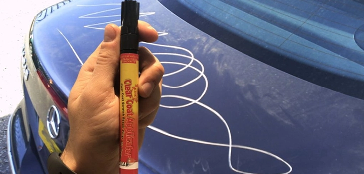 car scratch pencil in use